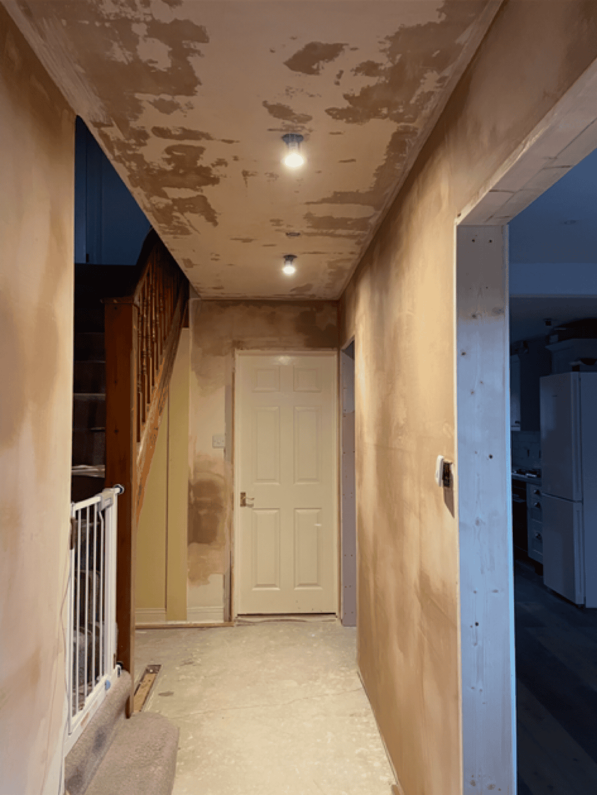 Interior wall renovation with plastering and finishing work.